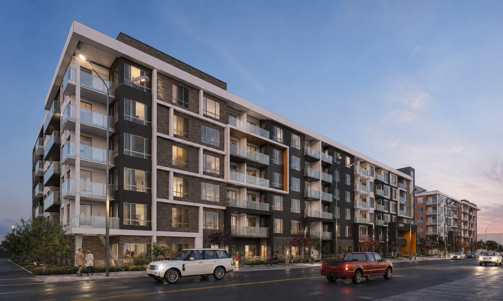 Lilac Park from the street at dusk, with suite windows lit